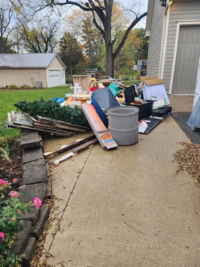 Dumpster being loaded with debris for Commercial Dumpster Rental in Mount Horeb